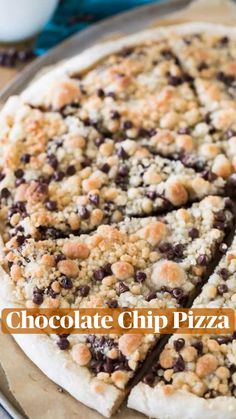 a chocolate chip pizza cut into slices on a pan with the words chocolate chip pizza