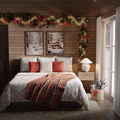 a bedroom decorated for christmas with lights and decorations