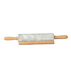 a rolling dough on a wooden roller with a white cloth wrapped around the top and wood handle