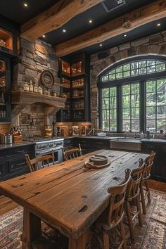 a rustic kitchen with stone walls and wooden table