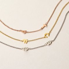 This 2 Letter Rose Gold Sideways Initial Necklace is right on trend with a stylish and delicate look. Crafted from .925 sterling silver and plated in rose gold   the asymmetrical necklace is adorned with two petite 1/4 inch block letters offset on a 16 inch rolo chain with 2 inch extender. Wear your own initials  your children's or your loved one's for a personalized look that pairs perfectly with any outfit. The 2 initial necklace is made to order  so the completed initials may vary in look fro Coordinates Jewelry, Asymmetrical Necklace, Sideways Initial Necklace, Custom Initial Necklace, 2 Letter, Block Letters, Monogram Jewelry, Cz Stud Earrings, Gold Initial