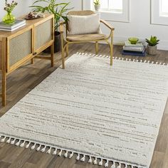 Introducing the Azilal Area Rug - a truly unique and elegant statement piece for any home! With its bohemian global style, this rug is sure to turn heads. Crafted from soft polyester, this machine-woven rug features a high pile that will add texture and comfort to any space. The fringe adds an extra element of interest that will make it the focal point of your room. Plus, with its durable construction, you can enjoy this area rug for years to come. For best results, pair with a rug pad (not incl Area Rugs Bedroom, Farmhouse Area Rugs, Dhurrie Rug, Moroccan Trellis, Cozy Rugs, Rugs Bedroom, Abstract Area Rug, Area Rug Living Room, Synthetic Rugs