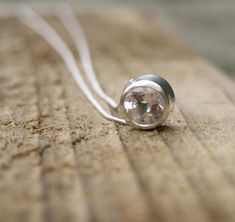 A 6mm white topaz slider necklace, very simple, very elegant.I can make this silver topaz necklace with other stones and in other metals, just ask for a quote.A smaller size is available athttps://www.etsy.com/uk/listing/205659618/silver-slider-necklace-silver-birthstonefor other topaz and silver jewellery got to:www.etsy.com/shop/karenjohnsondesignor Facebook.com/karenjohnsondesign.In stock and ready to ship. White Topaz Necklace, Slider Necklace, Bridal Accessory, Gold Topaz, Topaz Engagement Ring, Topaz Pendant, Topaz Necklace, Silver Wedding Bands, Silver Wedding Rings