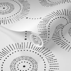 an abstract wallpaper with black and white circles on it's surface, as well as a spiral design