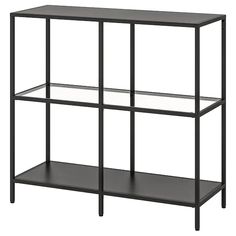 a black shelf with glass shelves on each side