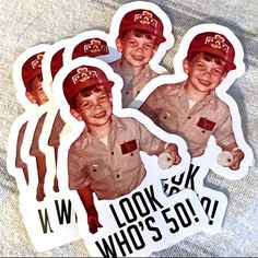 four stickers depicting the same boy in uniform as they appear to be wearing red caps