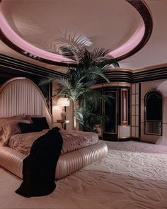 a large bed sitting in the middle of a bedroom next to a palm tree on top of a rug