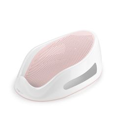 a white and pink speaker on a white surface