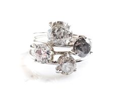 three diamond rings sitting on top of each other