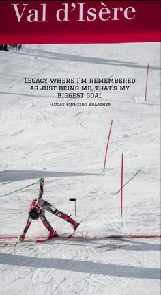 a man riding skis down the side of a snow covered slope next to poles