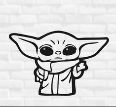 the baby yoda sticker is shown on a white brick wall, and it looks like