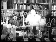 an old time photo of two people in front of bookshelves with bottles and beakles