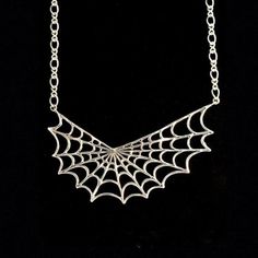 This Spider Web Pendant is cast in solid sterling silver and measures 2 and 3/4" across from tip to tip and 1" from the center of the web to the bottom.A split 16" Figure Eight Chain is included in the price of the pendant. This makes the length just over 19" total in length.This item usually ships the same or next business day.All Marty Magic Jewelry is packaged in a beautiful purple box, embossed with the gold foil Marty Magic dragon logo.Perfect for any occasion!Designed in Santa Cruz, Califo Spider Web Necklace, Web Necklace, Owl Necklace Silver, Dragon Logo, Magic Dragon, Magic Jewelry, Spider Jewelry, Jewelry Halloween, Halloween Necklace