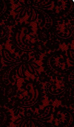 a red and black background with an intricate design