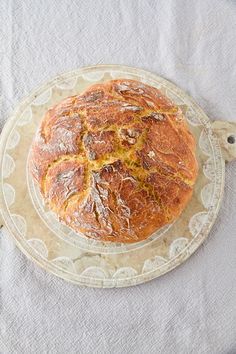 a loaf of bread sitting on top of a glass plate