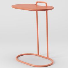 an orange table with a handle on the top and one leg in the shape of a circle