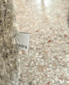 there is a label that says edra on the side of a fur - covered coat