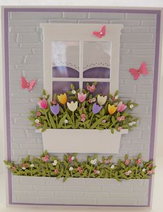 a card with flowers in a window box and butterflies on the windowsill above it