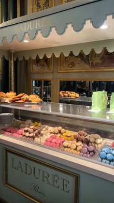 a display case filled with lots of different types of donuts