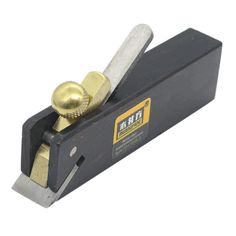 a close up of a planer with a ball on the handle and two screws in it