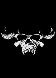 a skull with horns and glasses on it's face is shown in the dark