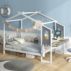 a child's bedroom with blue walls, white furniture and decorations on the ceiling