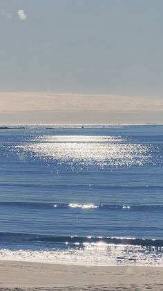 the sun shines on the ocean as it reflects off the water's surface