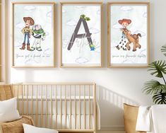 three children's art prints hang on the wall above a crib