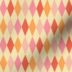 an orange, pink and yellow argyle pattern is shown on a white background with black dots