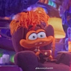 an animated character with orange hair sitting in front of a purple and blue background at night