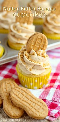 cupcakes with cookies and cream frosting on a checkered tablecloth