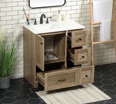 a bathroom vanity with two drawers and a mirror on the wall above it, next to a rug