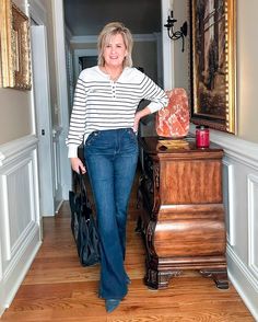 Spring Transition Outfits, Tania Stephens, Over 50 Fashion, Henley Sweater, Transition Outfits, Cropped Flare Jeans, Roll Neck Sweater, Jean Trends, Raw Hem Jeans