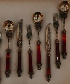 an assortment of antique silverware including forks and spoons