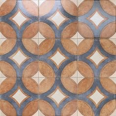 an artistic tile design with circles in brown and blue