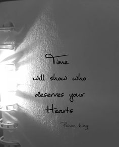 a white wall with a quote on it that says time will show who deserves your hearts