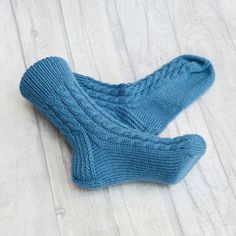 These socks are so comfortable you'll want to wear them all year long. Our hand knit socks provide a higher quality of craftsmanship, which means you can enjoy them year round, year after year. Never again will you leave the comfort of your warm bed to be awoken by an ice cold floor beneath your feet. Cuddling up with a blanket in front of the television will no longer be a choice of warm feet or warm shoulders.  You'll no longer need a space heater beneath the desk in your freezing office. Warm Comfortable Knitted Winter Socks, Comfortable Cable Knit Winter Socks, Cozy Chunky Knit Socks, Cozy Chunky Knit Socks With Round Toe, Comfortable Hand Knitted Winter Socks, Comfortable Thick Knitted Socks, Thick Cable Knit Casual Socks, Comfortable Knit Socks As Gift, Casual Knitted Socks For Gifts