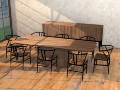 a table and chairs are arranged in an empty room with wood flooring on the side