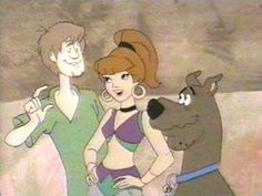 two cartoon characters standing next to each other with one dog on his shoulder and the other holding an object in its mouth