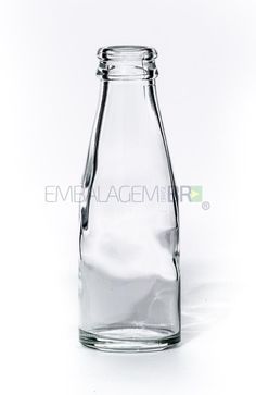 an empty glass bottle on a white background