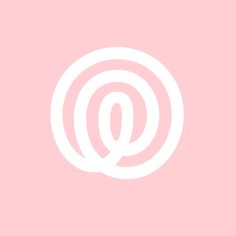 the letter q in a white circle on a pink background