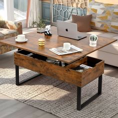 a coffee table with an open drawer underneath it