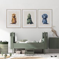 three paintings of dinosaurs hang on the wall above a bed in a child's room