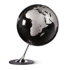 a black and white globe on a metal stand with an upside down view of the world