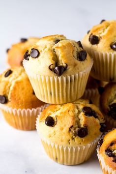 a pile of muffins with chocolate chips on top