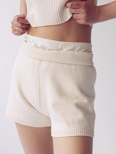 These are knit short pants with a light length. This is an attractive item with a moderate length that goes above the knees and a clean, semi-A-line silhouette. You can complete a sophisticated set-up look when paired with a knit top of the same material.- Comfortable to wear with waist banding- Minimal design makes it great for styling- Uses high-quality Tencel blended yarn with a soft feel*The color of the product may differ from the actual color depending on the monitor resolution. Chic Ribbed Short Length Bottoms, Comfy Shorts With Ribbed Waistband, Beige Knit Shorts For Loungewear, Chic Cream Knit Bottoms, Cozy Loungewear Shorts With Ribbed Waistband, Spring Knit Shorts, Ribbed Loungewear Shorts, Beige Knit Shorts, Beige Shorts