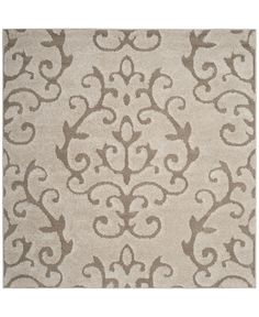 a beige rug with an intricate design on it