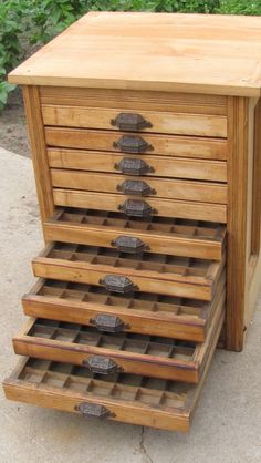 a wooden drawer with five drawers on it