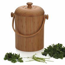 a wooden bucket with some parsley next to it