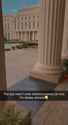 an image of the outside of a building that has columns in front of it and is captioned